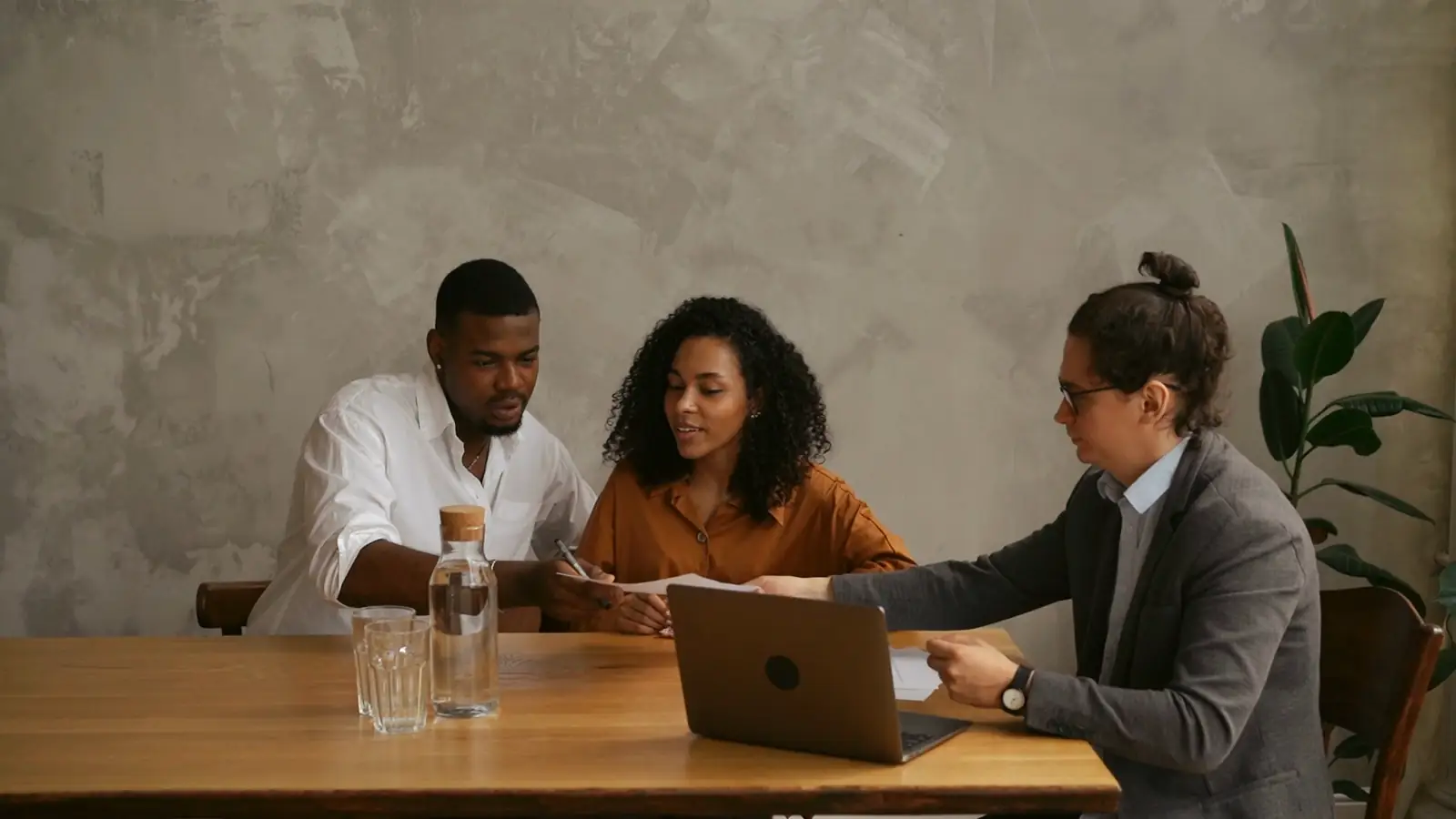 Old stock about-page photo turned into the new site's real in-person meeting video
